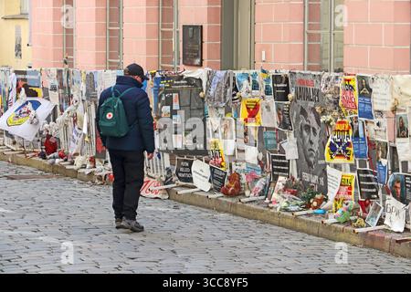 Man looking at Railings outside Russian Embassy covered in anti russian placards, Tallin Stock Photo