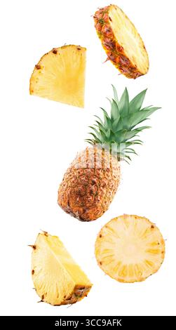 falling pineapple with slices isolated on white background. Stock Photo