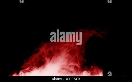 burning red smoke on a black background. Stock Photo