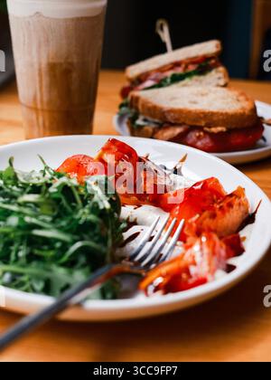 Arugula–Tomato Salad with Balsamic and BLT, Latte in Background Stock Photo
