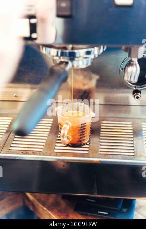 Espresso Pour from Group Head (Front View) Stock Photo