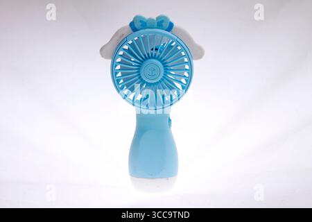 Blue portable fan isolated on a white background. Stock Photo