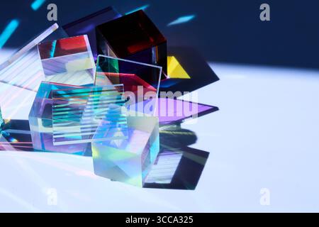 Colorful Prisms and Shadows. A vibrant composition of geometric prisms casting colorful shadows. Stock Photo