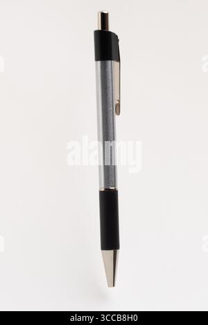 The pen features a polished silver clip and a pointed tip, suggesting readiness for writing Stock Photo