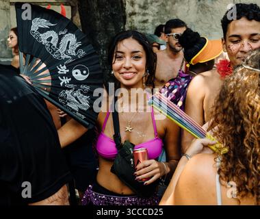Rio de Janeiro, Brazil - February 23, 2025 - A woman smiles during a Carnival street party. Stock Photo