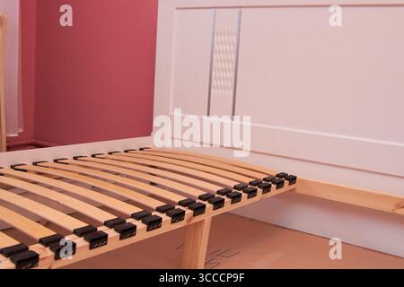 curved wooden slats for the bed, assembling the slats bed Stock Photo