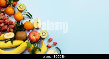 Food banner background on blue with vegan products, fresh fruits, vegan food, top view, veganuary, vegan day concept, copy space Stock Photo