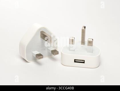 Couple of Apple USB power adapter chargers model A1399 with 3-pin UK plugs for compatible Apple devices Stock Photo
