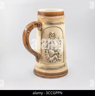 Close up of a traditional vintage German beer mug on a white background Stock Photo