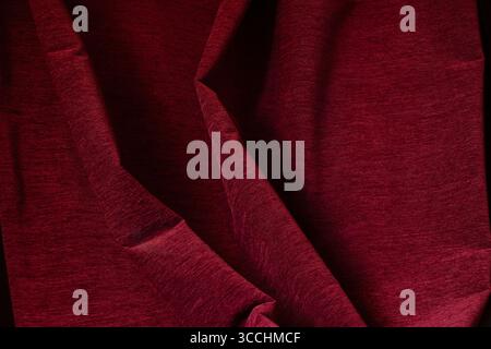 Red fabric folds, curtains close-up as texture for background or template Stock Photo
