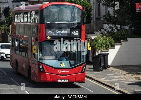 LONDON, UK - AUGUST 5, 2025 - Red double decker Arriva bus number 468 to South Croydon, South End, driving in a residential area of London, United Kin Stock Photo