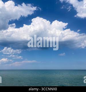 Puffy clouds sail over Lake Michigan in Milwaukee, Wisconsin, USA. Stock Photo