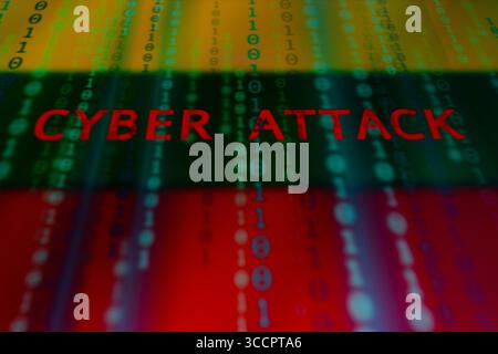 July 10, 2023, Asuncion, Paraguay: The words ''cyber attack'' and binary code digits backdropped by cropped flag of Lithuania displayed on a screen. (Credit Image: © Andre M. Chang/ZUMA Press Wire) Stock Photo