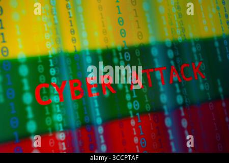 July 10, 2023, Asuncion, Paraguay: The words ''cyber attack'' and binary code digits backdropped by cropped flag of Lithuania displayed on a screen. (Credit Image: © Andre M. Chang/ZUMA Press Wire) Stock Photo
