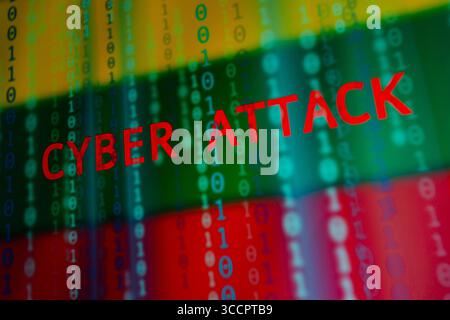July 10, 2023, Asuncion, Paraguay: The words ''cyber attack'' and binary code digits backdropped by cropped flag of Lithuania displayed on a screen. (Credit Image: © Andre M. Chang/ZUMA Press Wire) Stock Photo