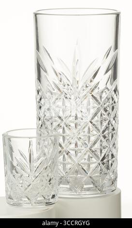 A pair of clear diamond-patterned drinking glasses isolated nature background with clipping path Stock Photo