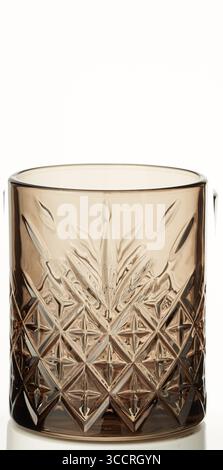 Diamond pattern clear glass in tea color isolated nature background with clipping path Stock Photo