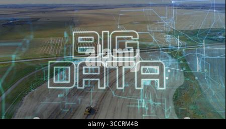 Displaying stylized BIG DATA text overlaying farmland, with tractor and circuit patterns Stock Photo