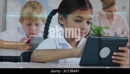 Girl with braided hair wearing white shirt interacting with tablet in classroom, world map behind Stock Photo