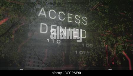 Displaying 'ACCESS DENIED' text overlaying dense forest, with binary code and red circuit traces Stock Photo