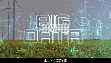 Displaying neon-glowing BIG DATA text spanning across field with wind turbines and network circuits Stock Photo
