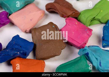 brown plasticine for modeling and initial creativity, soft plasticine in a box of different colors is used for creative work Stock Photo
