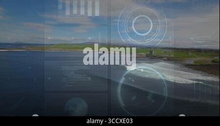 Displaying digital interface overlay over coastal shore, with futuristic HUD elements Stock Photo