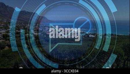Holographic envelope icon hovering in coastal hillside view, with translucent HUD and binary code Stock Photo