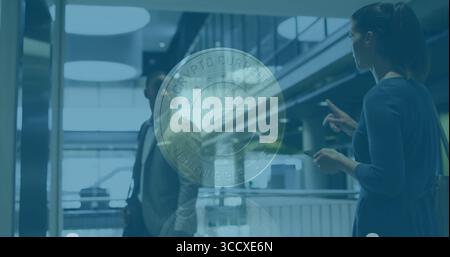 Floating translucent coin graphic displaying NFT Crypto Currency Non-Fungible Token in atrium Stock Photo