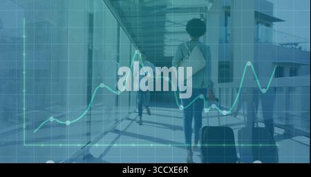 Walking woman pulling black suitcase in airport corridor, with green graph overlay, copy space Stock Photo