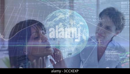 Two business professionals analyzing data in meeting room, with holographic globe and code overlays Stock Photo