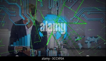 Analyzing digital globe and bar charts executive wearing suit holding tablet in office, copy space Stock Photo