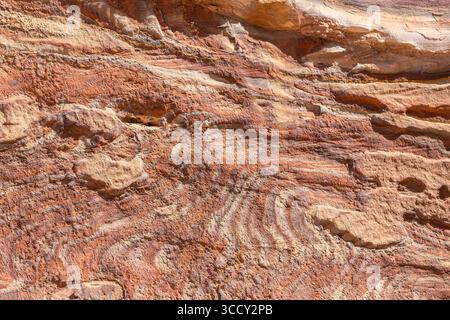 Multi-colored sandstone rock and mineral layers in ancient tombs of Petra, Jordan. Pattern, geological stone texture Stock Photo