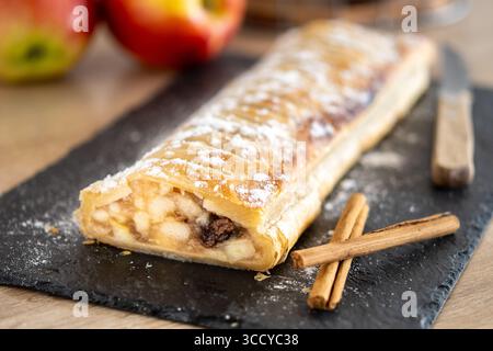 Homemade apple strudel on wooden table Stock Photo
