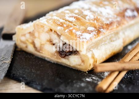 Homemade apple strudel on wooden table Stock Photo