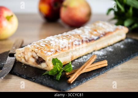 Homemade apple strudel on wooden table Stock Photo