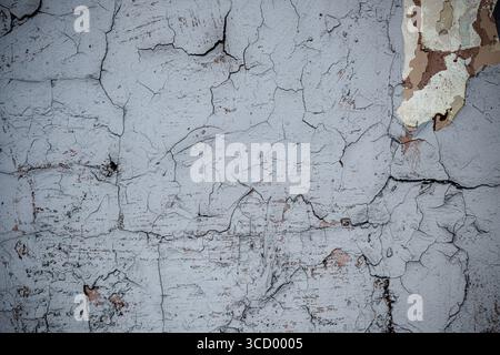 Old grunge wall with cracked paint. High resolution vintage background. Stock Photo