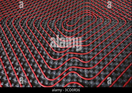 Room with tubes of radiant underfloor heating installation Stock Photo