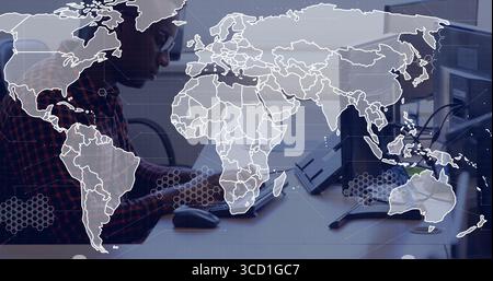 Working man wearing checkered shirt focusing on computer with dual monitors at office, copy space Stock Photo