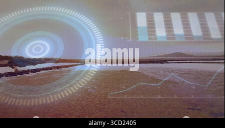 Displaying circular HUD overlaying salt flat at dusk, with digital grid, bar chart and line graph Stock Photo
