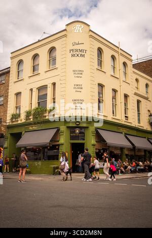 LONDON- JULY 28, 2025: Dishoom Permit Room bar cafe restaurant on Portobello Road in Notting Hill. Modern Indian food Stock Photo