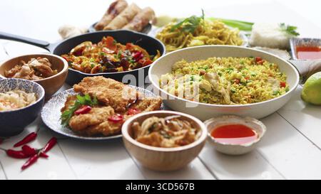 Chinese food set. Chinese noodles, fried rice with chicken, shrimps, spring rolls, deep fried crispy chicken. Asian style food concept composition Stock Photo