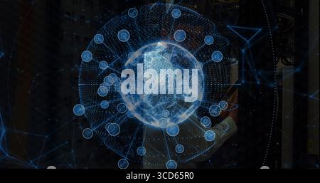 Analyzing IT engineer in blazer viewing holographic globe in data center aisle, with server racks Stock Photo