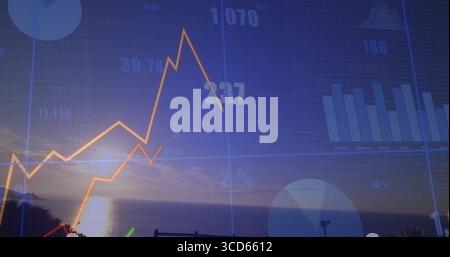 Showing yellow-orange line graph rising then falling at seaside, with translucent grid overlay Stock Photo