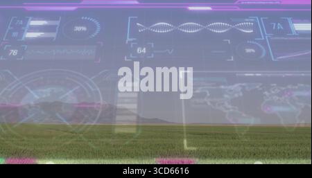Displaying digital overlay spanning grassland to mountain horizon, with charts waveform graphs map Stock Photo