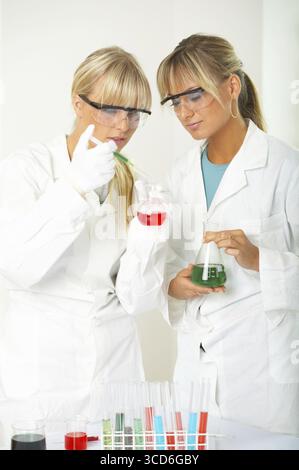 Female lab workers testing and experimenting Stock Photo