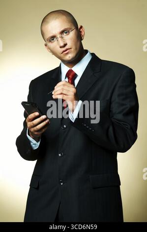 A businessman using PDA computer Stock Photo - Alamy