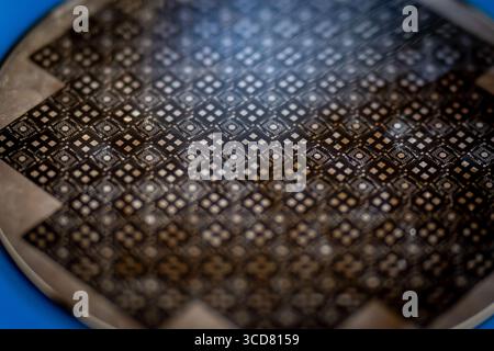 CARDIFF, WALES - JULY 15: A close-up of a silicon wafer on July 15, 2025 in Cardiff, Wales. Stock Photo