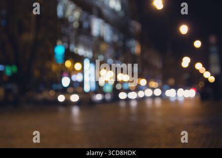 Blurred abstract bokeh background of city lights at night. Urban Stock Photo