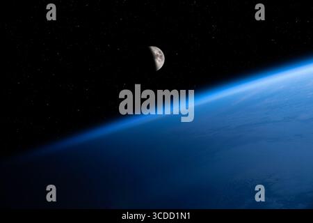 Amazing blue planet Earth and Moon in deep space. Waning crescent Moon over planet Earth. Elements of this image furnished by NASA. Stock Photo